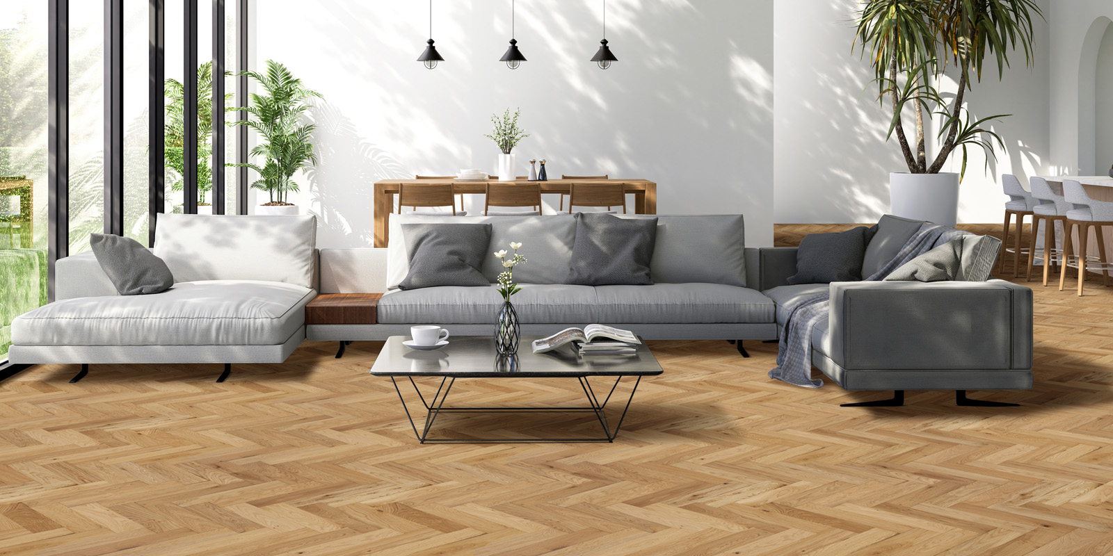 wooden herringbone floor with grey sofa